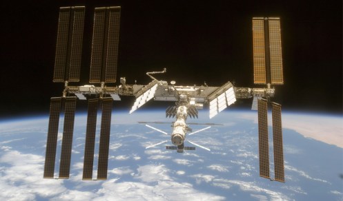 The ISS is seen from Space Shuttle Discovery as the two spacecraft begin their relative separation