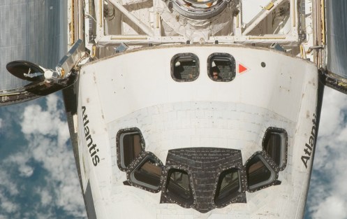An overhead view of the exterior of the Space Shuttle Atlantis' crew cabin, part of its payload bay doors and docking system was provided by Expedition 16 crewmembers