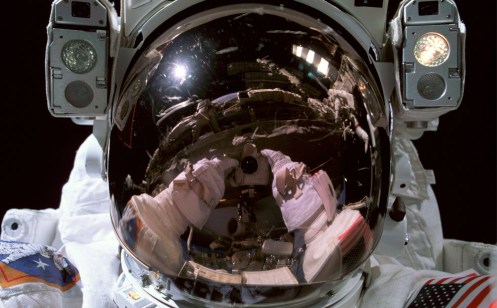 Astronaut Donald R. Pettit, Expedition 6 NASA ISS science officer, photographs his helmet visor during a session of extravehicular activity (EVA) on January 15th, 2003