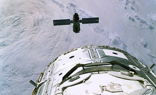 Russian-built FGB, also called Zarya, approaches the Space Shuttle Endeavour and the U.S.-built Node 1, also called Unity [foreground]