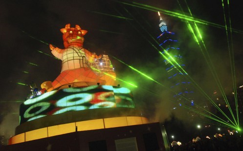 A giant ox lantern stands in the square of the Chiang Kai-shek Memorial Hall, near the Taipei 101 building during the 2009 Taipei Lantern Festival, Saturday, Feb. 7, 2009, in Taipei, Taiwan