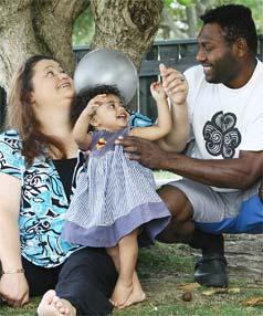 GOOD SIGN: Marama and Kepas Pala, both HIV positive, with their daughter Maiinga. They say the insurance move lowers the stigma they have to live with.
