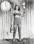 Esther Williams.  Holding really giant&nbsp;bells.