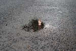 Isaac Cordal sculpture at a playground in London in 2010. Photo courtesy of Isaac&nbsp;Cordal.