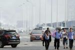 Chinese police help a man to safety on a highway near the explosion site. (Ng Han&nbsp;Guan)