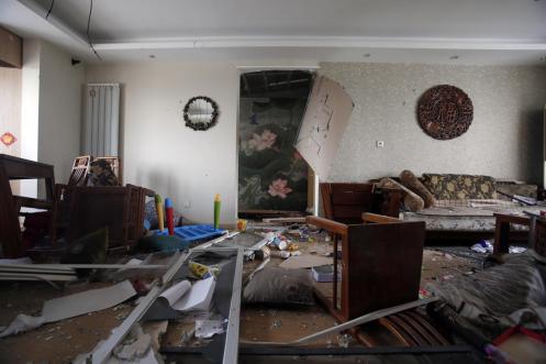 The shock waves from the explosions broke furniture, windows and other property in nearby residences. (Chinatopix via Associated Press)